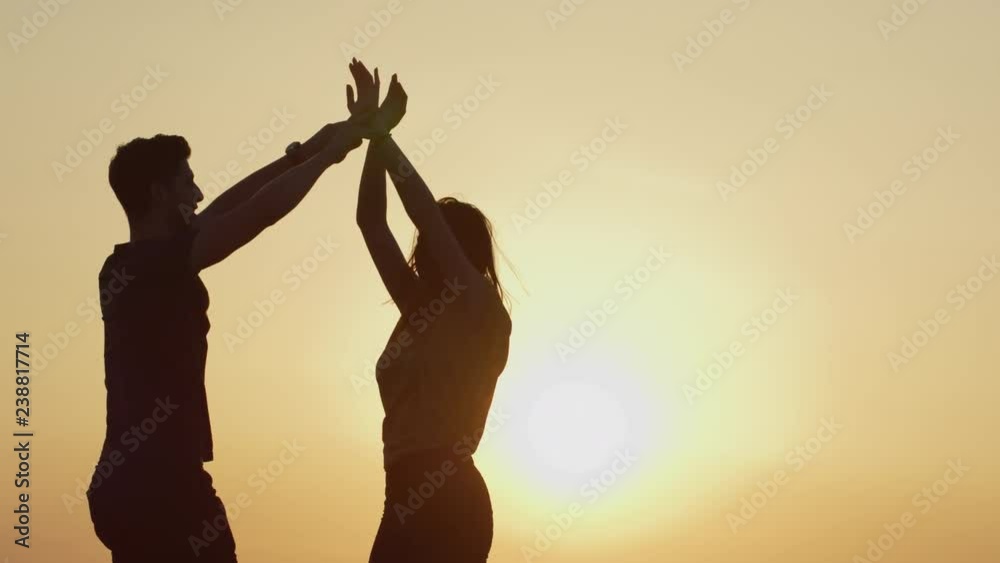 Happy couple giving high five
