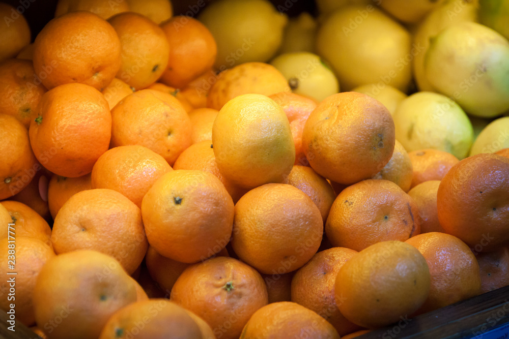 A lot of tangerines counter. fruit at the grocery store. sale and discounts A lot of tangerines counter. fruit at the grocery store. sale and discounts