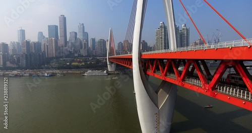 Abstract aerial view of colorful cars trying to navigate through a traffic jam, as two lanes merge at an intersection in Chongqing, urban China.