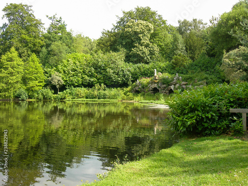 lake, trees and stone fountain, England