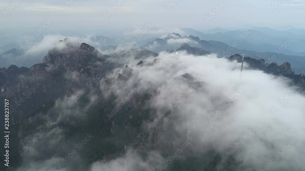 Panoramic aerial drone view of mysterious foggy landscape of Huangshan national park, one of China's most popular tourist destinations