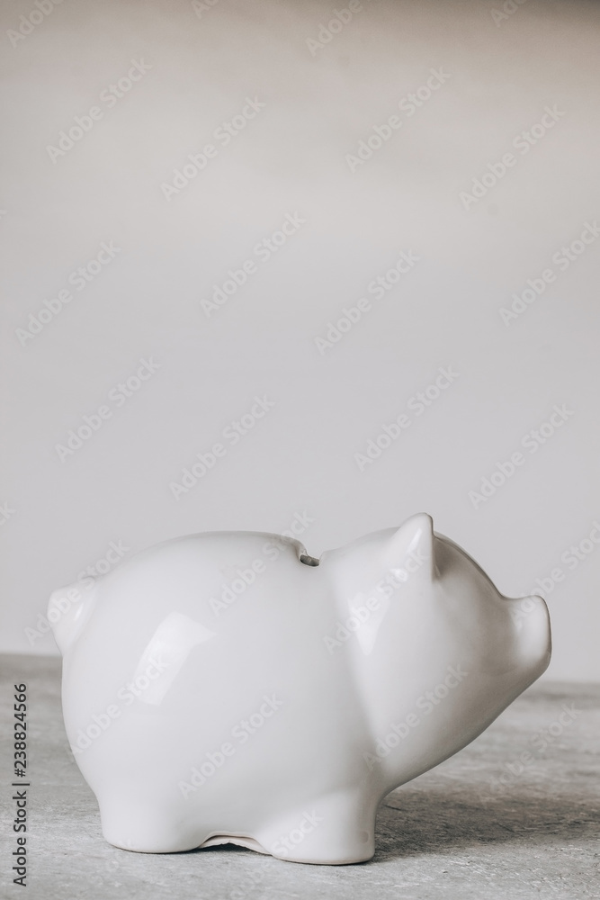 saving money white piggy bank on seamless gray background. saving money white piggy bank on seamless gray background.