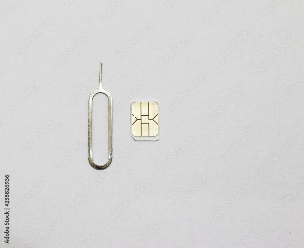 Nano sim card and Eject tool on white paper background Stock Photo ...