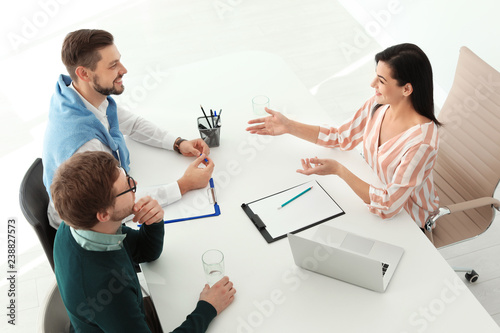 Human resources manager conducting job interview with applicants in office