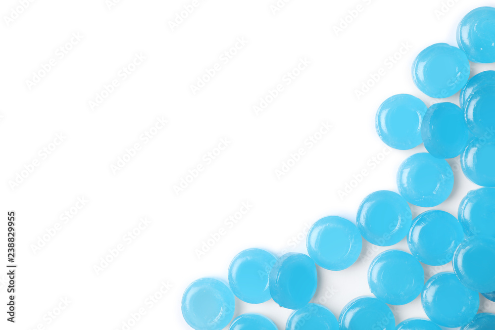 Color cough drops on white background. Top view with space for text Color cough drops on white background. Top view with space for text