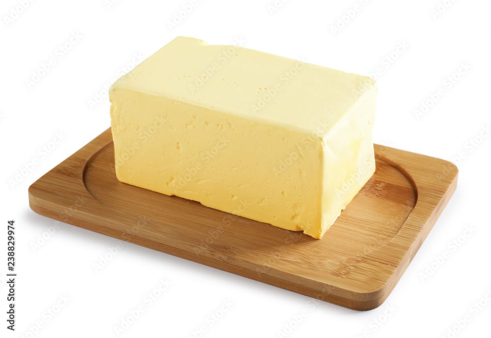 Wooden board with block of fresh butter on white background