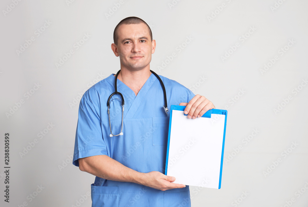 Portrait of medical assistant with stethoscope and clipboard on color background. Space for text Portrait of medical assistant with stethoscope and clipboard on color background. Space for text