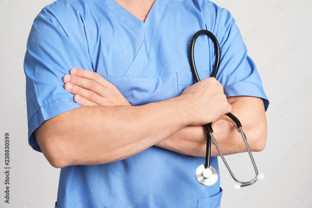 Medical assistant with stethoscope on color background, closeup Medical assistant with stethoscope on color background, closeup