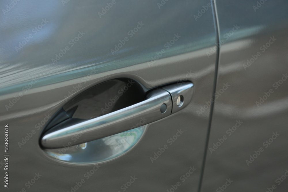 Closeup view of car door with handle