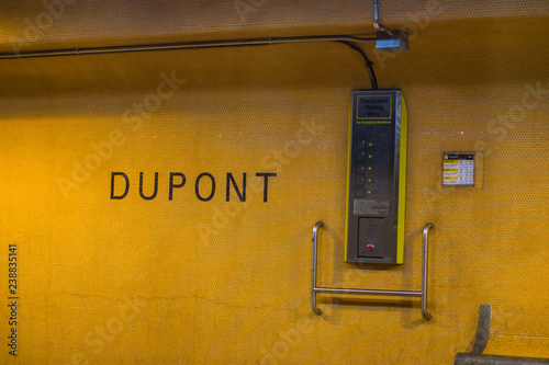 Photography Yellow tiled wall and station name at Dupont subway station in Toronto