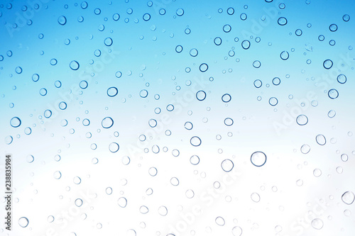 Abstract Water drops on blue glass Background - Image