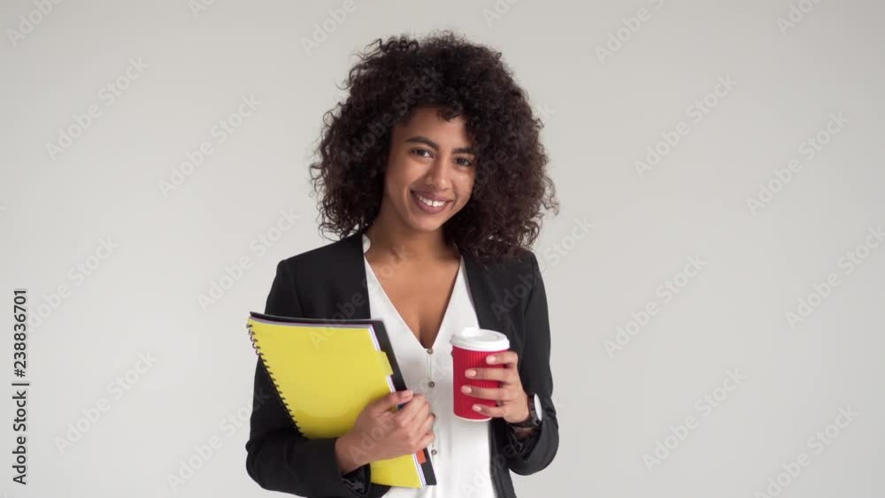 Happy businesswoman with coffee and file Happy businesswoman with coffee and file