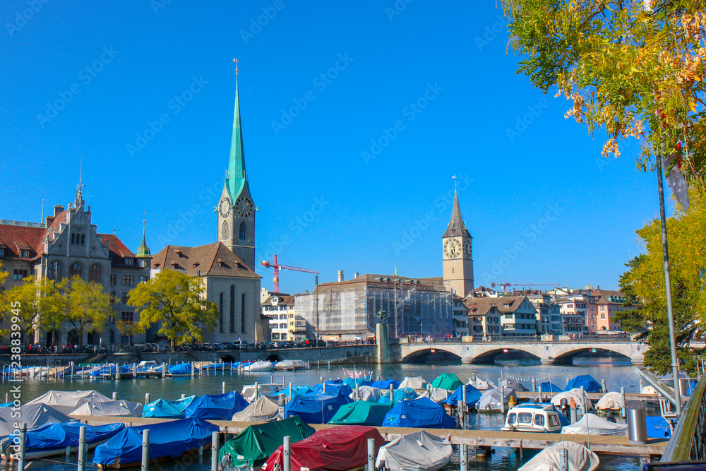 Fototapeta premium Zurich, Switzerland - Oct 13, 2018 : Beautiful view of historic city center on a sunny day with blue sky and clouds in summer.