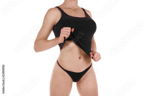Female cropped fit body in black tank top and panties, isolated on white.