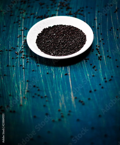 Brown Mustard Seeds background with copy space selective focus (ID: 238841151)