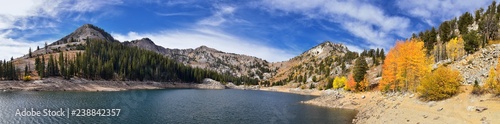 Silver Lake by Solitude and Brighton Ski resort in Big Cottonwood Canyon. Panoramic Views from the hiking and boardwalk trails of the surrounding mountains, aspen and pine trees in brilliant fall autu © Jeremy