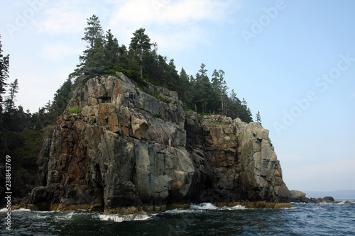 The rocky coast and cliffs of islands off Bar Harbor on Mount Desert Island, Maine.