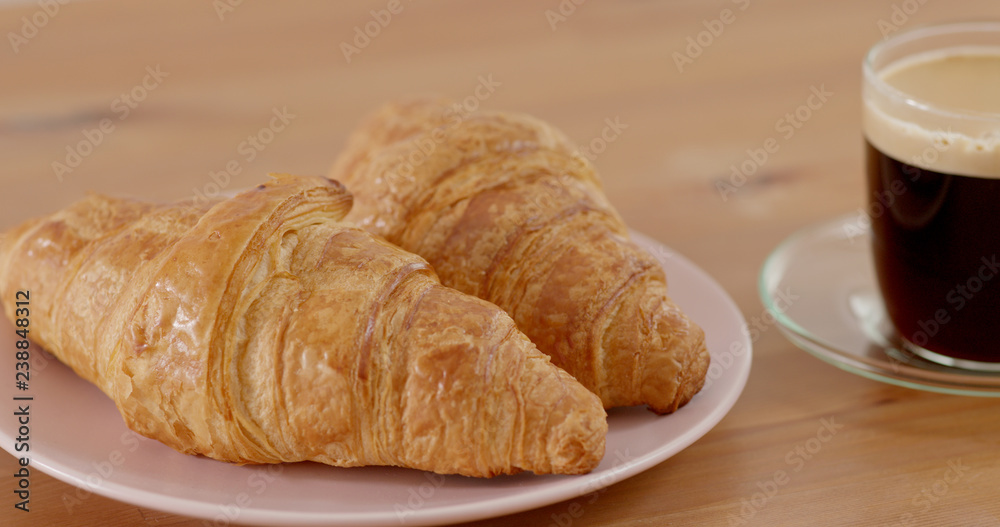 Croissant and coffee morning breakfast