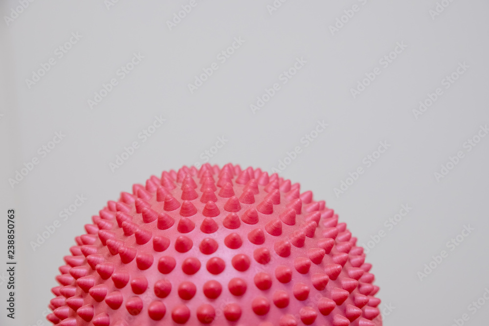 Spiky massage ball isolated on the white background.Flat feet correction exercise.half balance massage balls. rubber ball for self massage, reflexology and myofascial release.therapeutic exercise.Copy