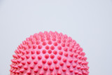 Spiky massage ball isolated on the white background.Flat feet correction exercise.half balance massage balls. rubber ball for self massage, reflexology and myofascial release.therapeutic exercise.Copy