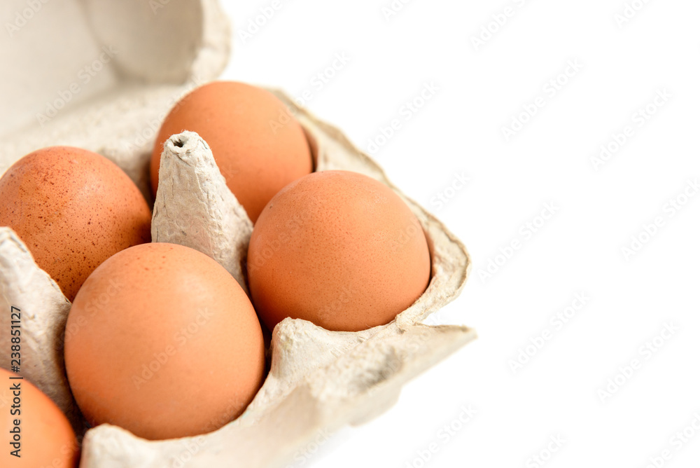 Eggs in pack isolated on white background