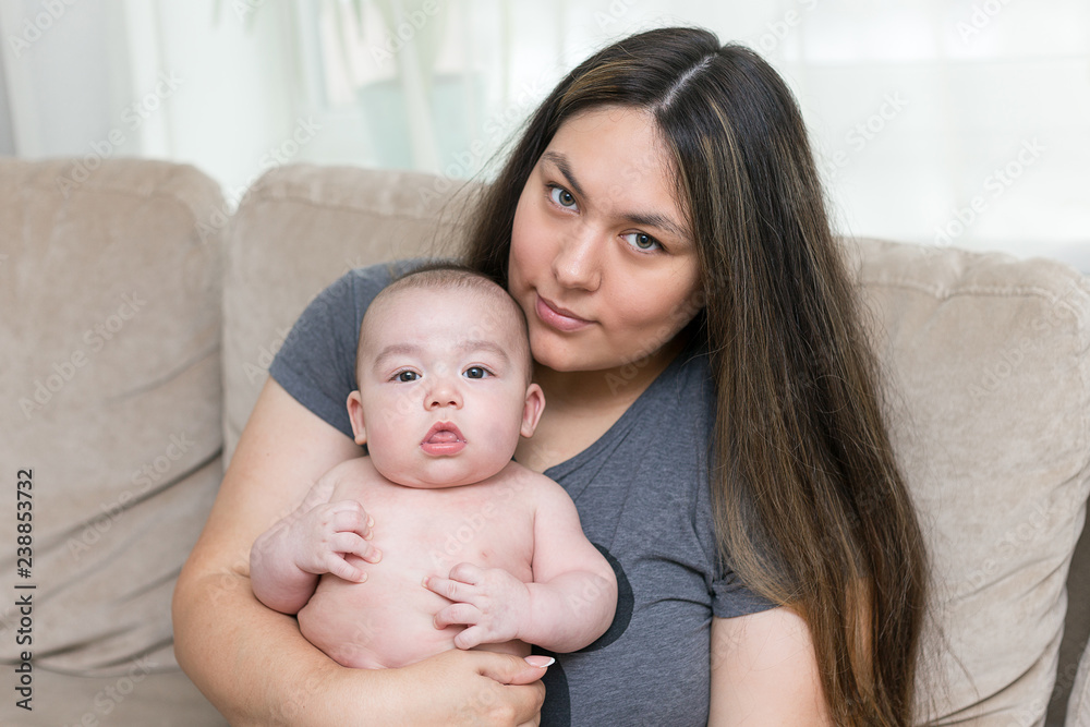 Mother is holding her newborn infant son Mother is holding her newborn infant son