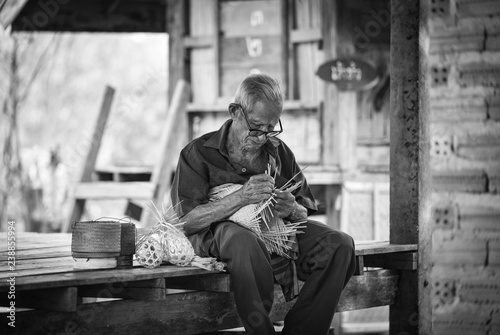 asia life old man uncle grandfather working in home / asia old man living in the countryside © Bigc Studio
