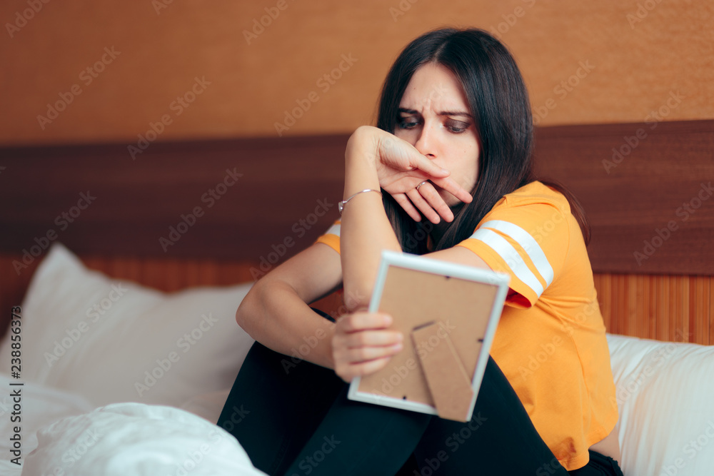 Sad Depressed Girl Crying After Break-up Holding Framed Picture Sad Depressed Girl Crying After Break-up Holding Framed Picture