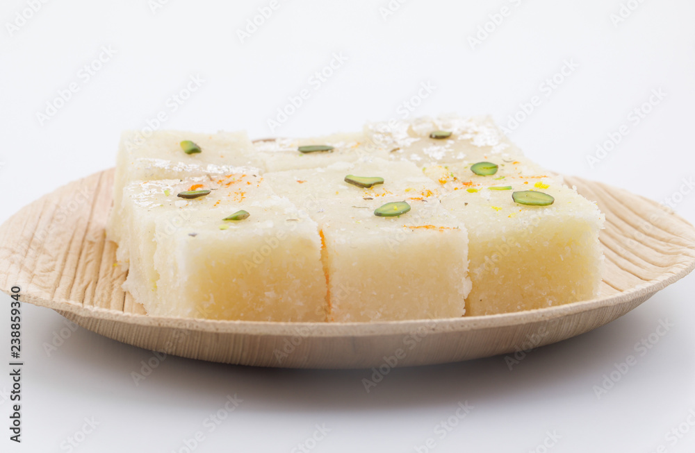 Indian Popular Sweet Food Khopara Pak or Coconut Burfi made up of Coconut, Milk And Sugar Isolated on White Background Indian Popular Sweet Food Khopara Pak or Coconut Burfi made up of Coconut, Milk And Sugar Isolated on White Background