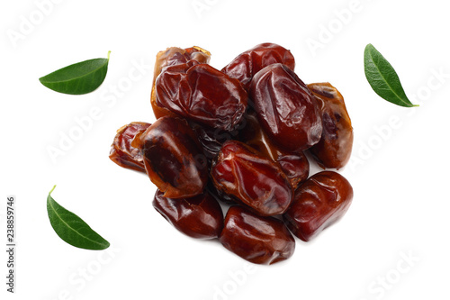 date fruits with green leaves isolated on white background. top view