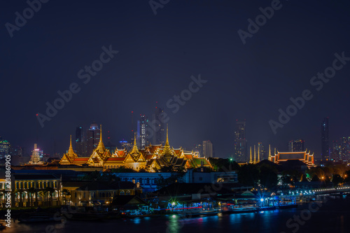 The beauty of the Golden palaces and phra keaw Temple ,The Chao Phraya River at night in Bangkok, Thailand.