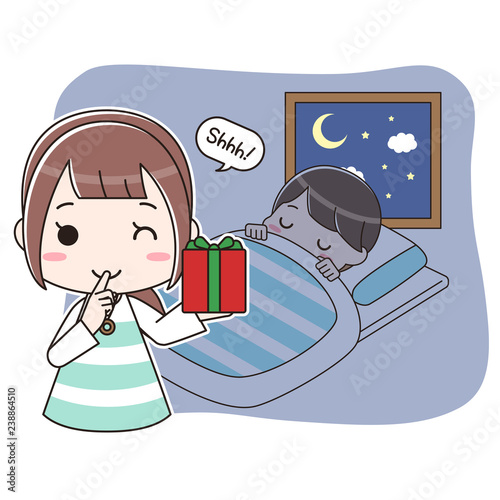 寝ている子供にプレゼントを置きに来たお母さん