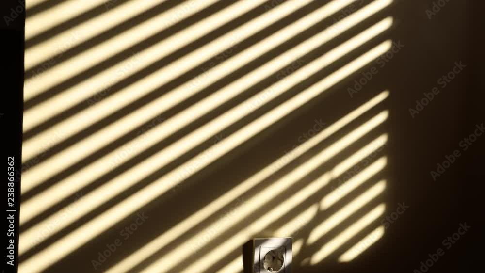 Blind shadow on the wall