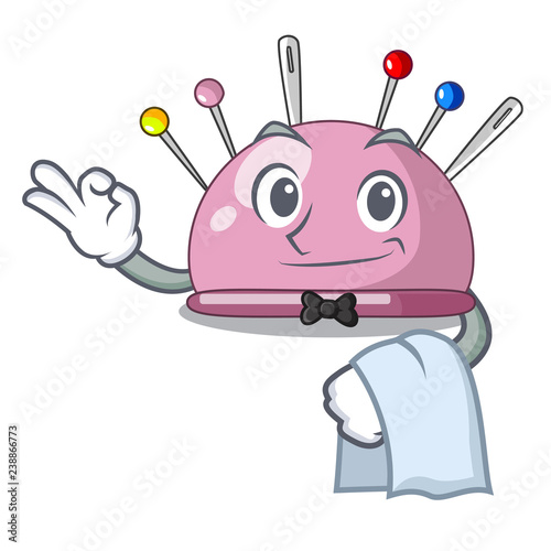 Waiter sewing pins and pincushion on mascot