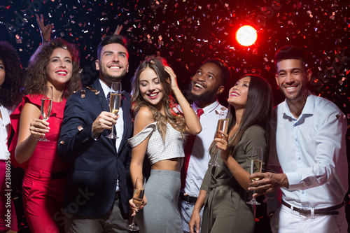 Happy diverse friends celebrating New Year together