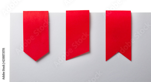 Red paper use as label banner ribbons on white background photo