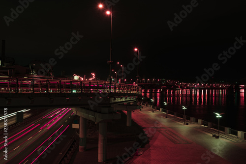 long exposure of road and bridge with illumination at night