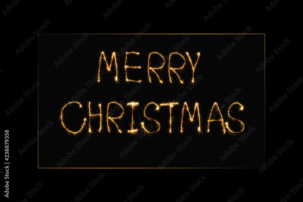 Obraz premium close up view of merry christmas light lettering on black backdrop