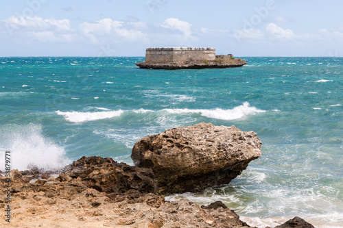 Sao Lourenco Blockhouse. San Lorenzo Island and fort nearby rocky shore and coastline of Mozambique island, Indian ocean coast. Portuguese East Africa photo