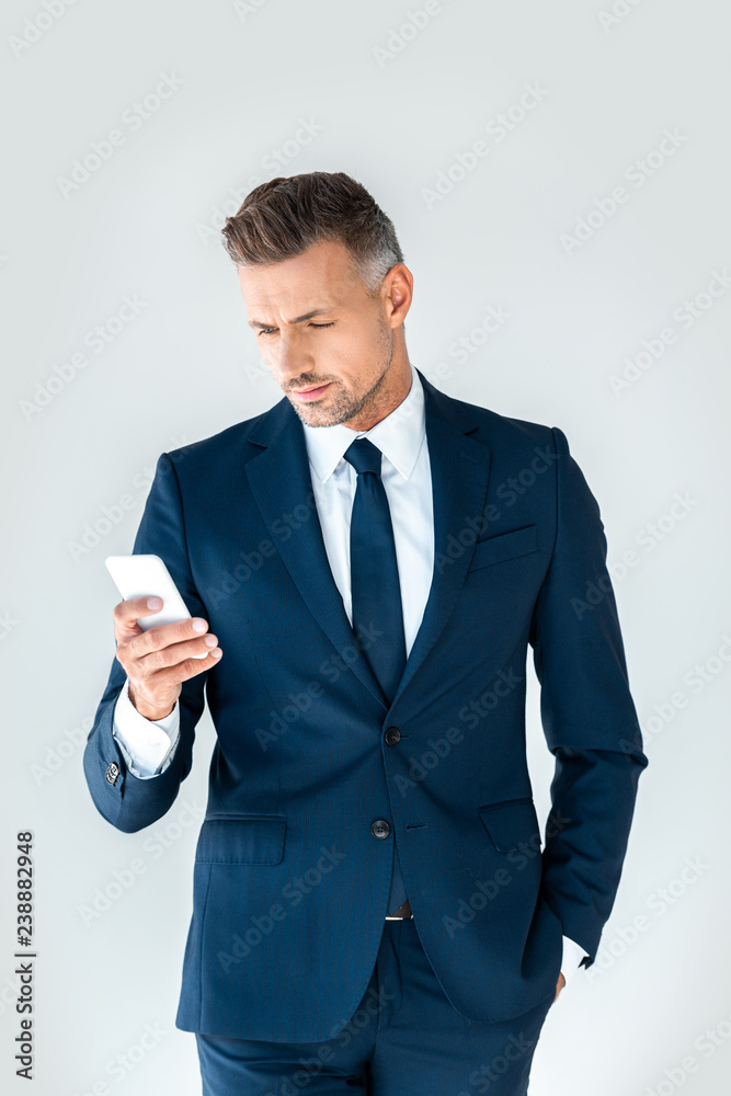 handsome businessman using smartphone isolated on white handsome businessman using smartphone isolated on white