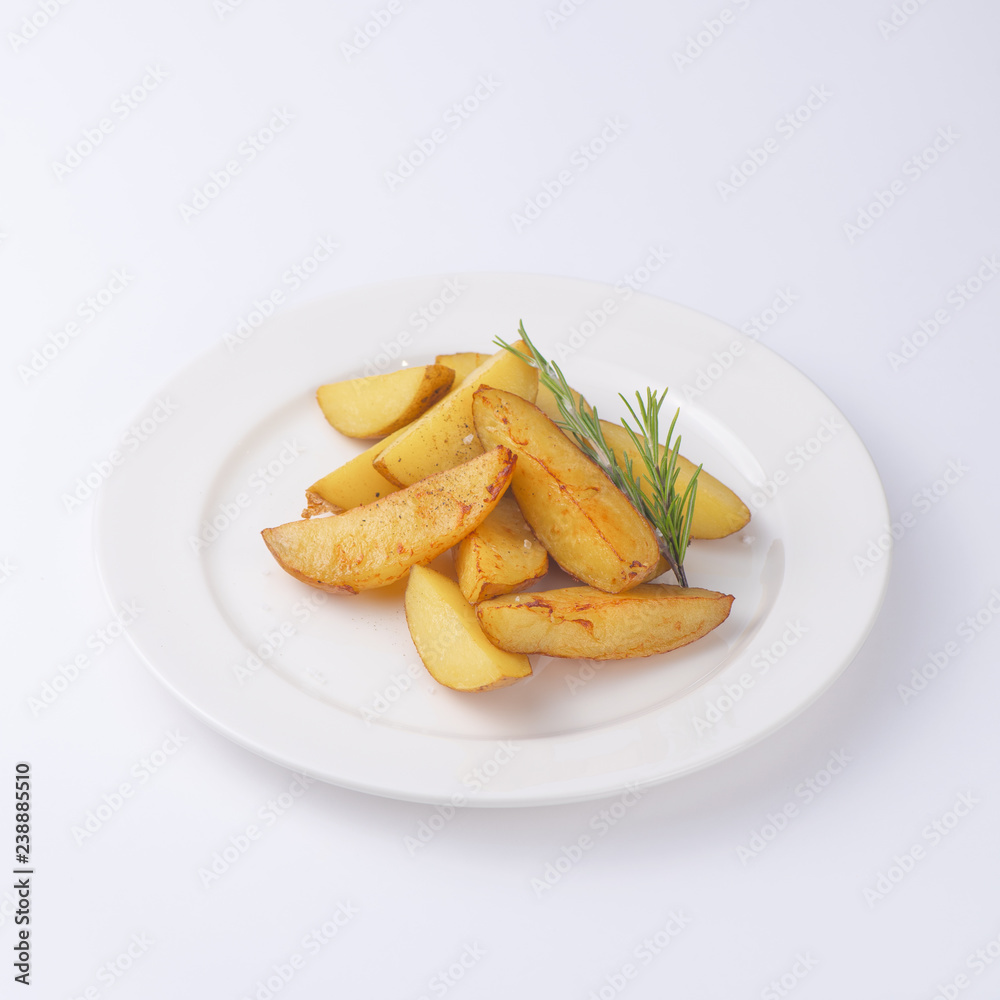 Crunchy fried potato slices with fresh rosemary isolated on white background Crunchy fried potato slices with fresh rosemary isolated on white background