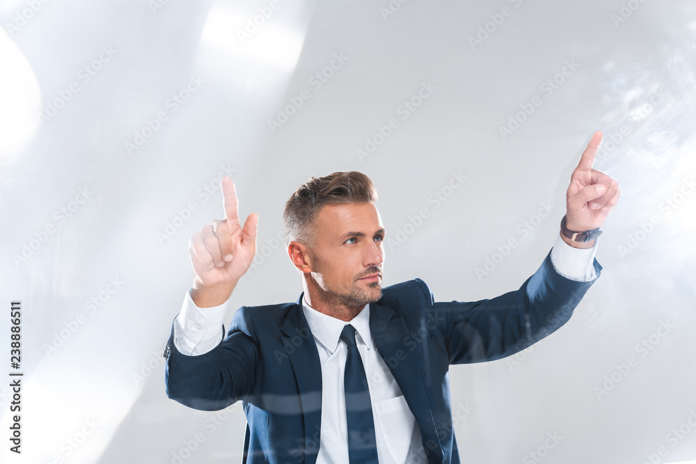 handsome businessman moving something isolated on white, artificial intelligence concept