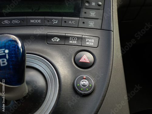 Turin, Piedmont, Italy. December 2018. LPG gas transformation of a Prius electric petrol hybrid Toyota, a gas plant of the BRC Piedmontese company. Close up on buttons EV, ECO, PWR mode