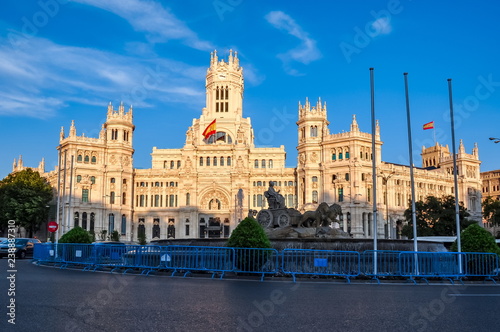 Cybele palace and fountain on Cibeles square at sunset, Madrid, Spain