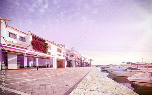 Shopping street near luxury boat. sunny day empty street. kozy pink color tone photo