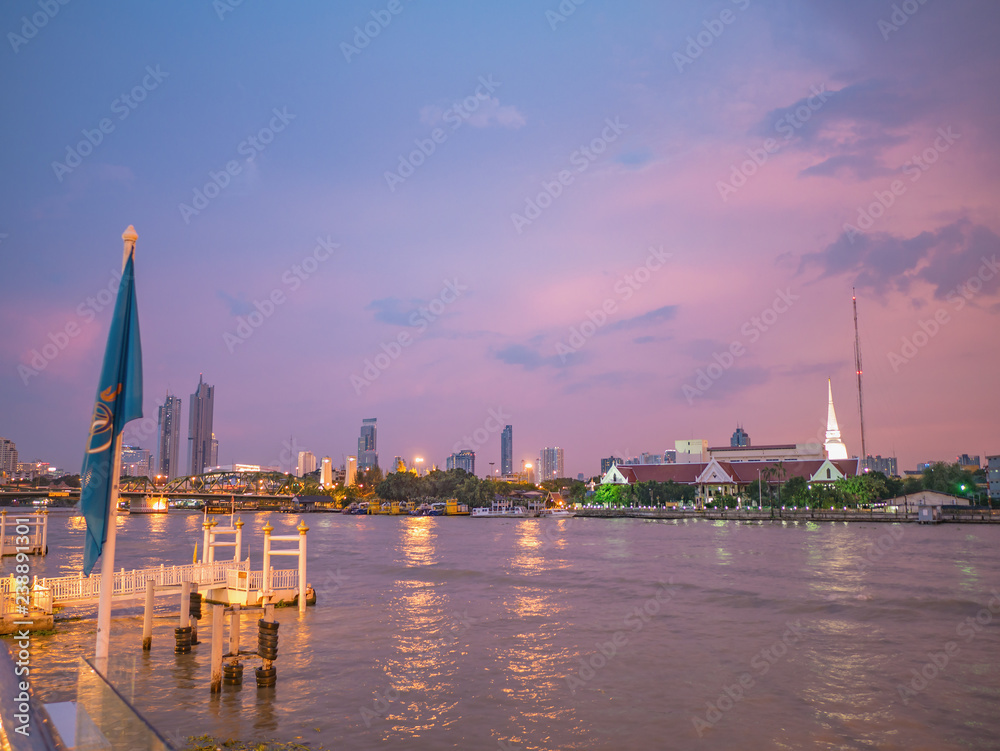 Fototapeta premium CityScape of Bangkok City and Chao Phraya River with Beautiful Sunset in Bangkok City Thailand