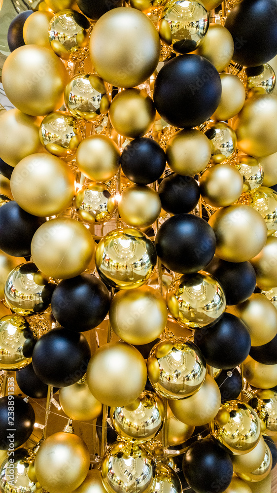 Golden and black Christmas tree balls background Golden and black Christmas tree balls background