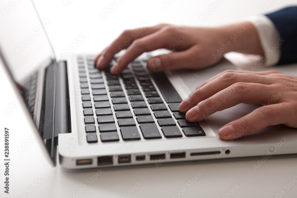 Close Up of businessman hands using laptop computer Close Up of businessman hands using laptop computer