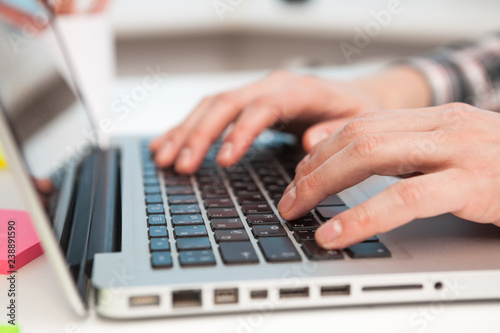 Close Up of businessman hands using laptop computer