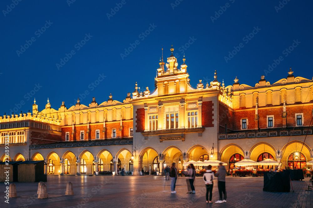 Krakow, Poland. Evening Night View Of Cloth Hall Building Of Mai